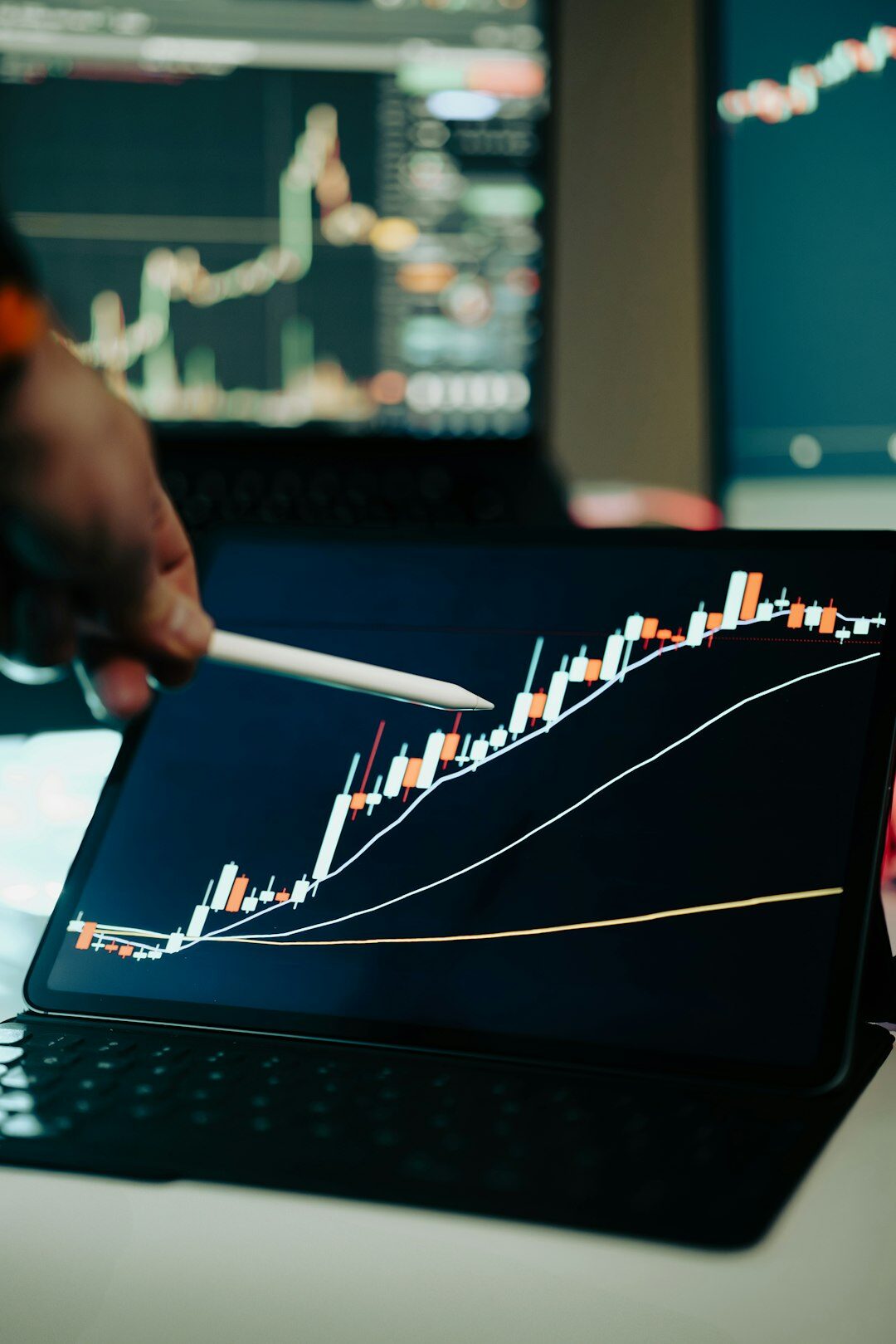 Business analysts reviewing growth charts on a large screen